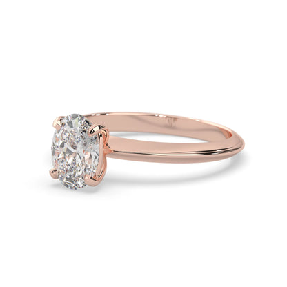 Rose-gold ring with a diamond on a white background