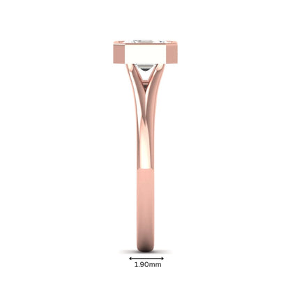 Asscher cut lab grown diamond bezel set split shank engagement ring in rose gold design.