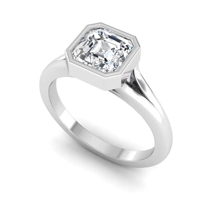 Asscher cut lab grown diamond bezel set split shank engagement ring in white gold design.