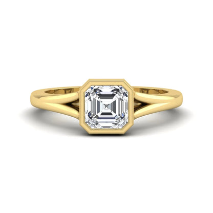 Asscher cut lab grown diamond bezel set split shank engagement ring in yellow gold design.