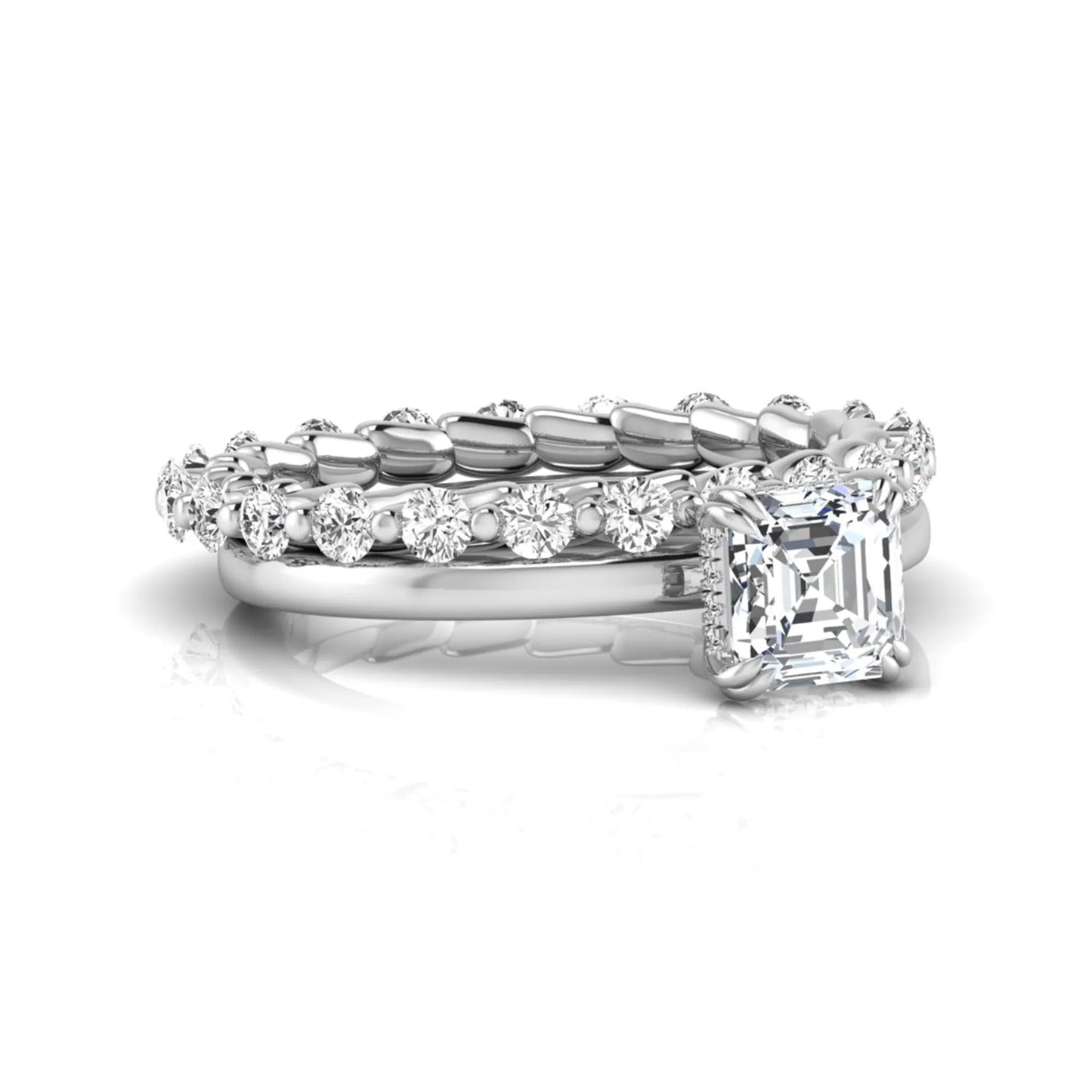 Asscher cut lab grown diamond bridal ring set featuring a four-prong solitaire engagement ring with a matching round diamond wedding band in white gold tone.