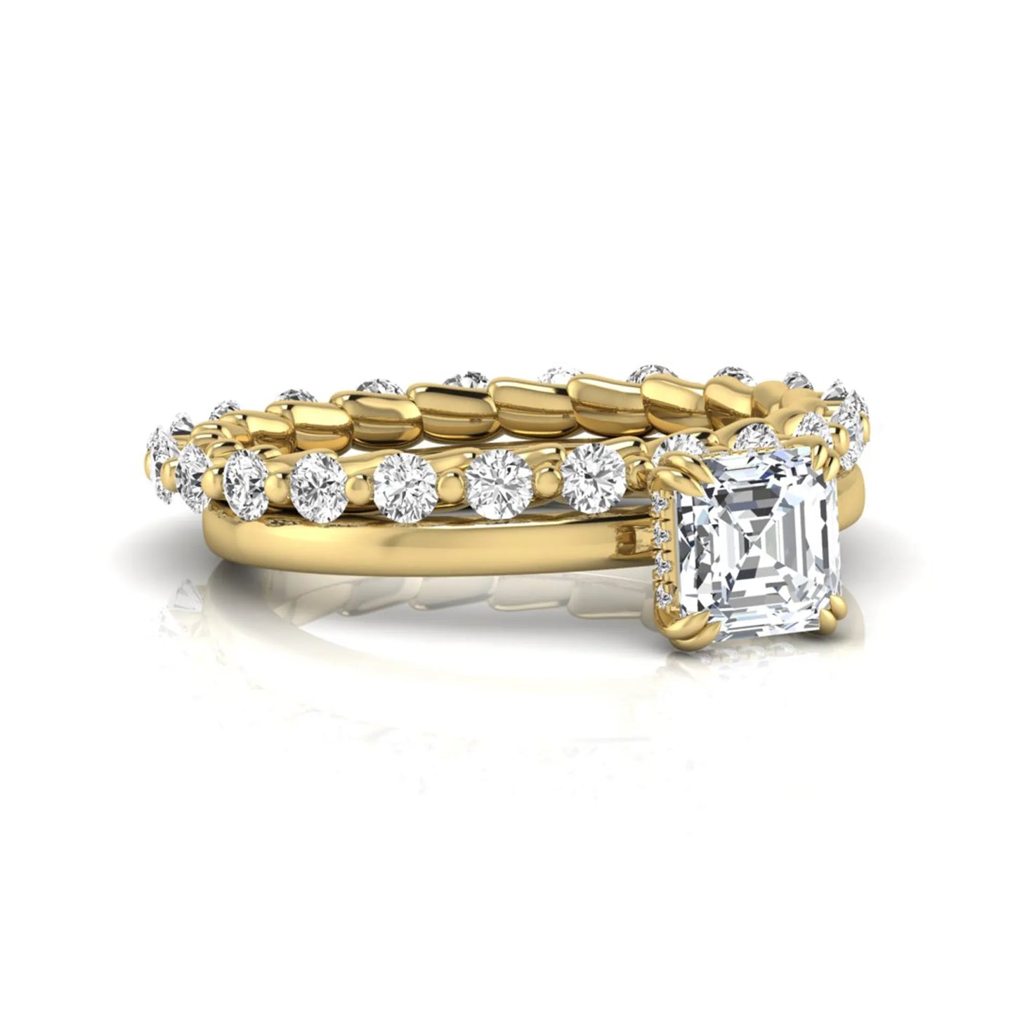 Asscher cut lab grown diamond bridal ring set featuring a four-prong solitaire engagement ring with a matching round diamond wedding band in yellow gold tone.
