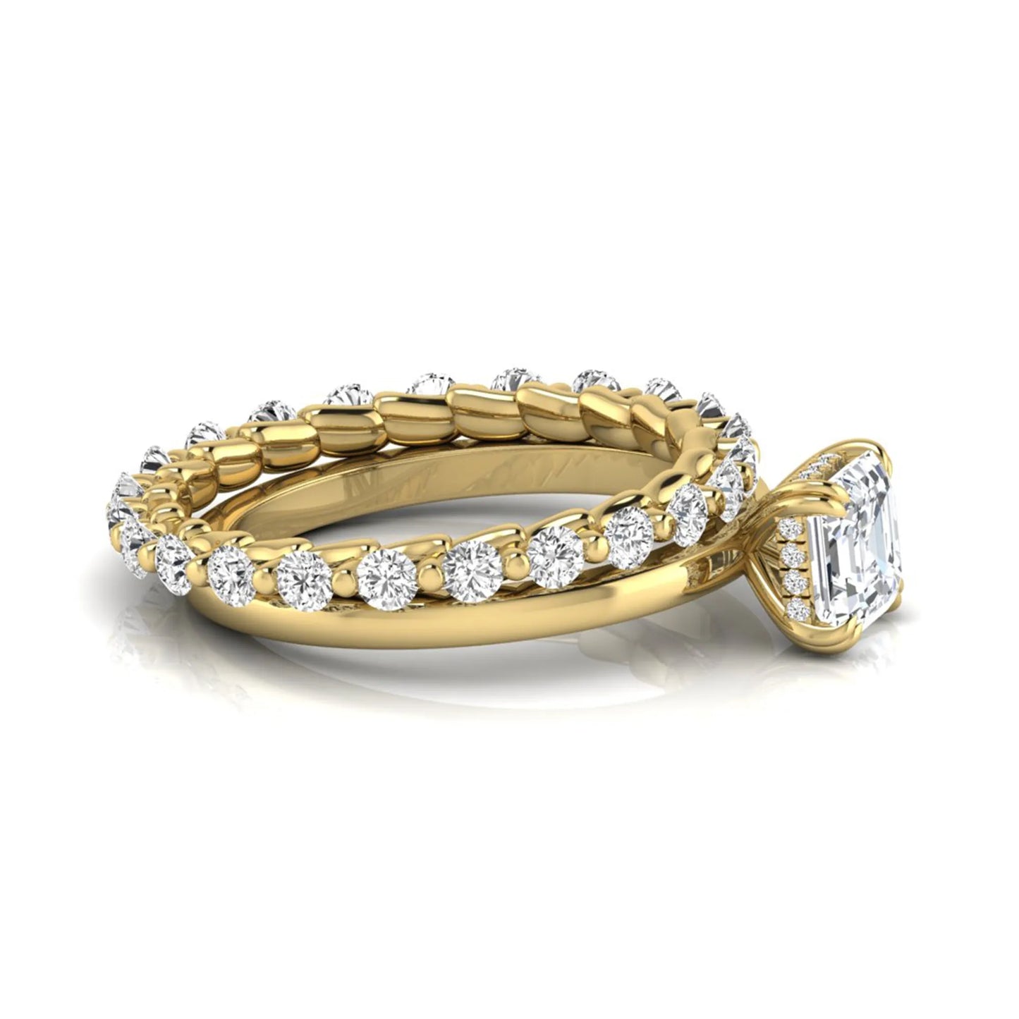 Asscher cut lab grown diamond bridal ring set featuring a four-prong solitaire engagement ring with a matching round diamond wedding band in yellow gold tone.