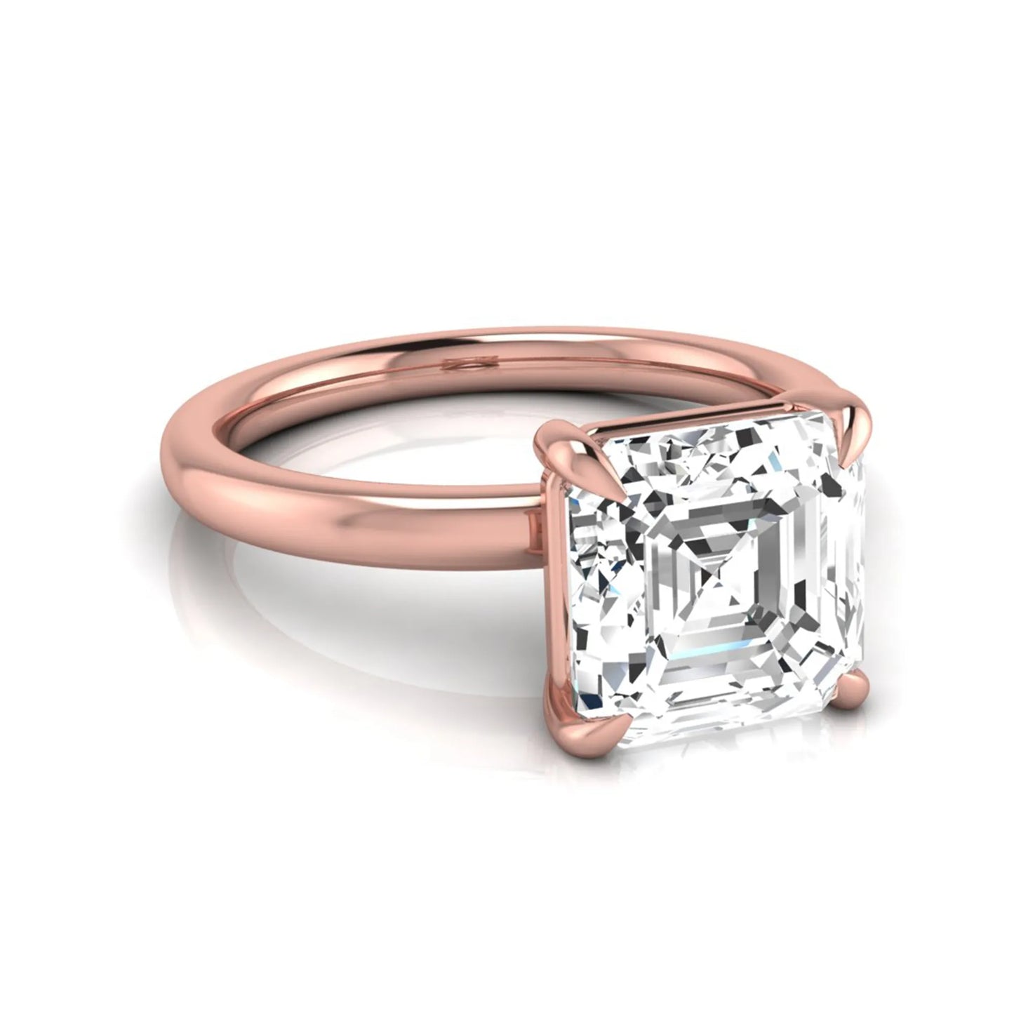 Asscher cut lab grown diamond solitaire engagement ring featuring a classic four-prong setting with a rose gold tone band.