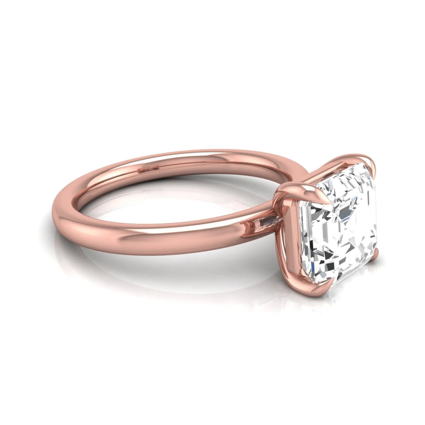 Asscher cut lab grown diamond solitaire engagement ring featuring a classic four-prong setting with a rose gold tone band.