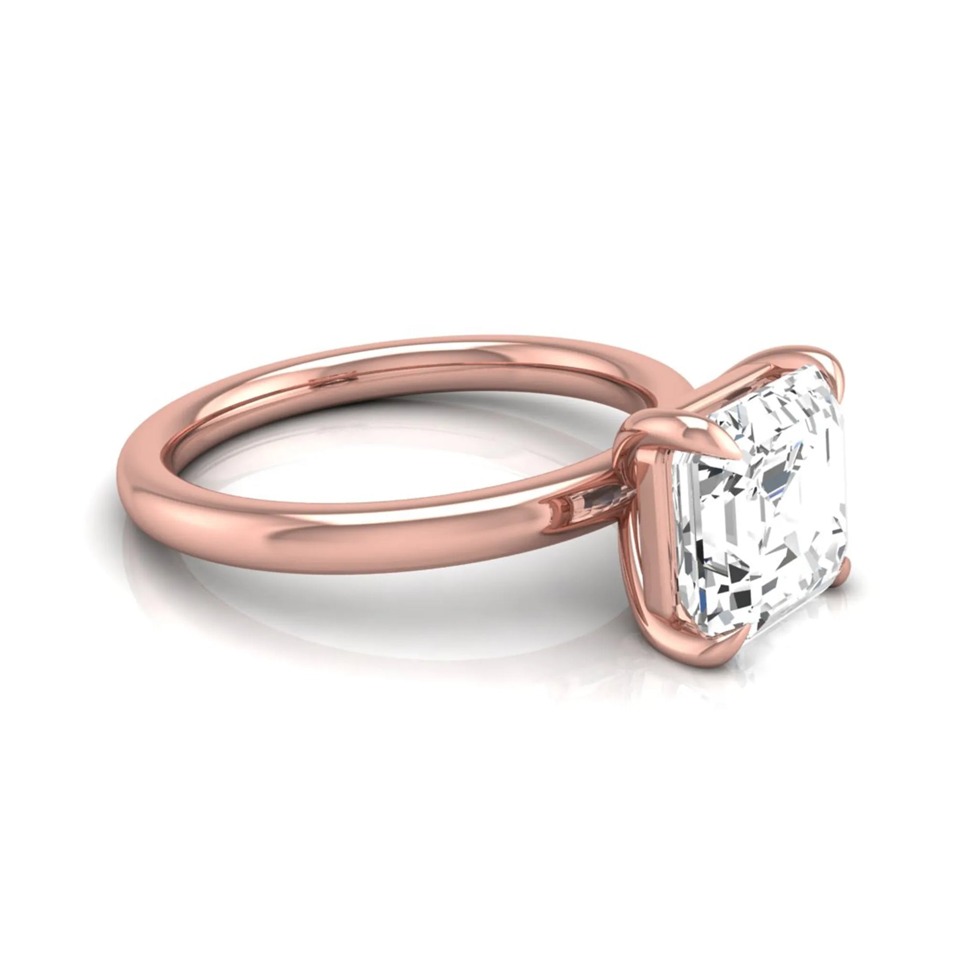 Asscher cut lab grown diamond solitaire engagement ring featuring a classic four-prong setting with a rose gold tone band.