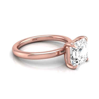 Asscher cut lab grown diamond solitaire engagement ring featuring a classic four-prong setting with a rose gold tone band.