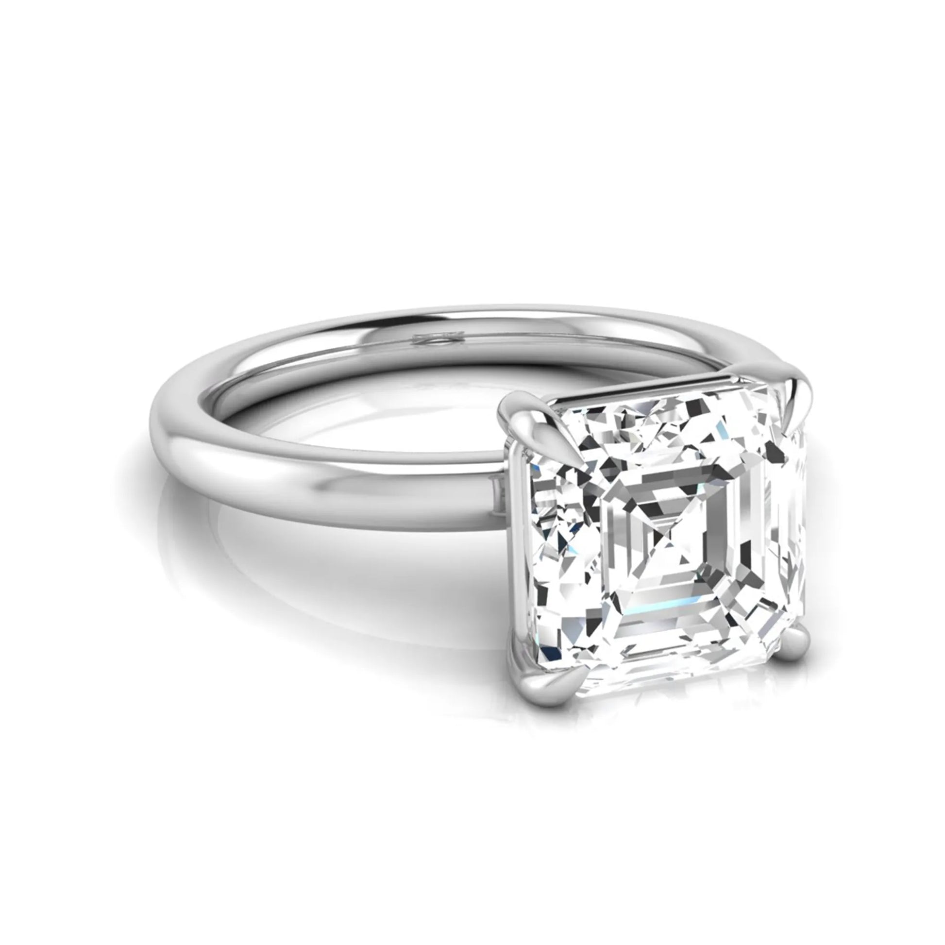 Asscher cut lab grown diamond solitaire engagement ring featuring a classic four-prong setting with a white gold tone band.