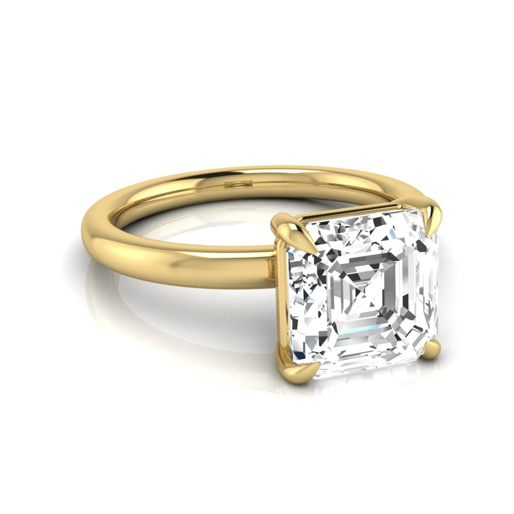 Asscher cut lab grown diamond solitaire engagement ring featuring a classic four-prong setting with a yellow gold tone band.