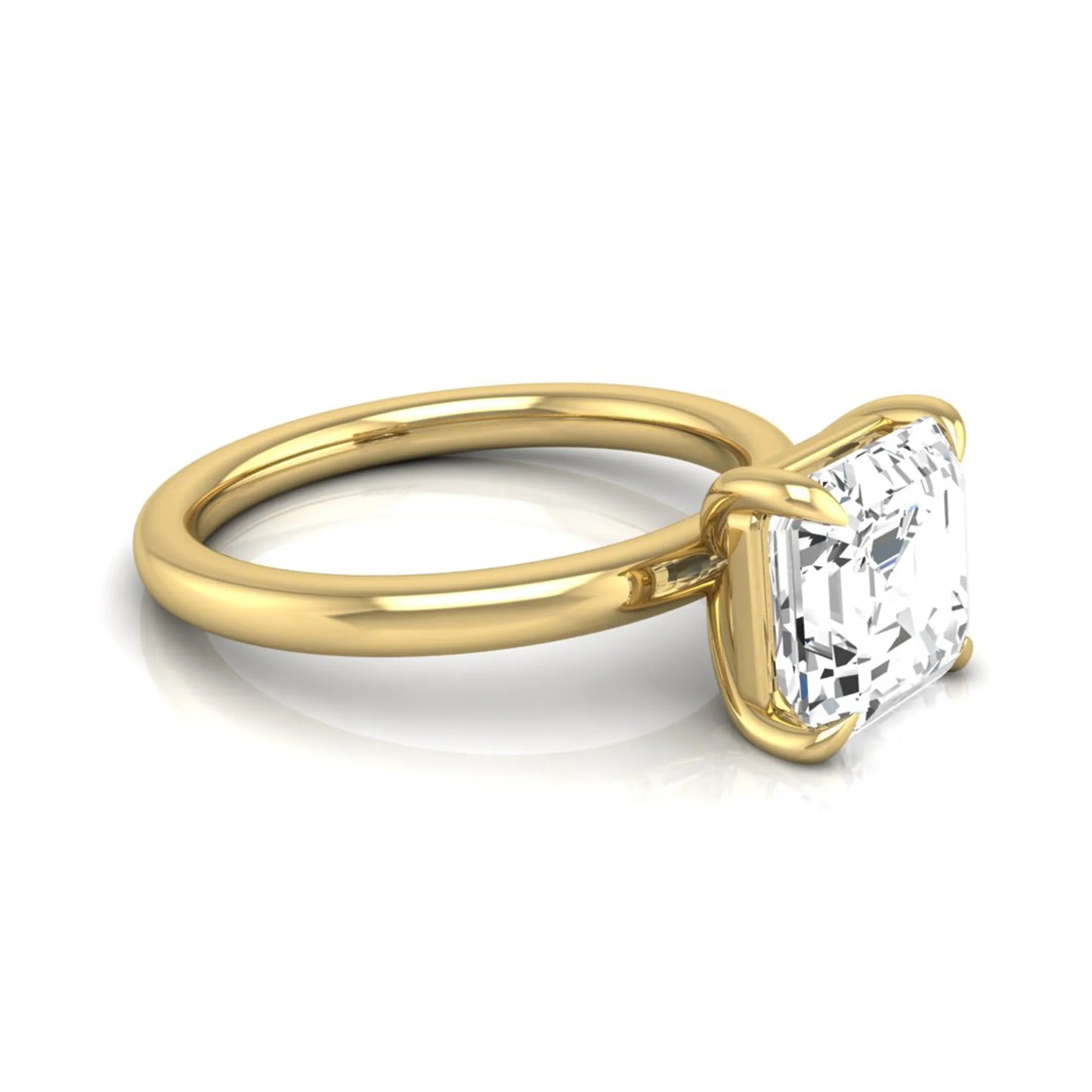 Asscher cut lab grown diamond solitaire engagement ring featuring a classic four-prong setting with a yellow gold tone band.