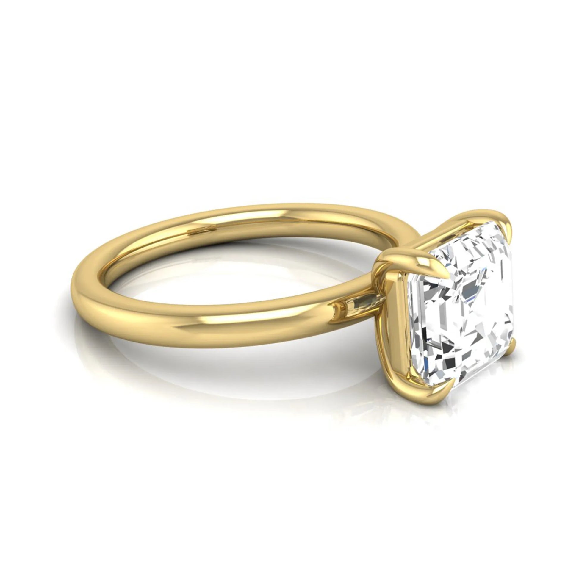 Asscher cut lab grown diamond solitaire engagement ring featuring a classic four-prong setting with a yellow gold tone band.