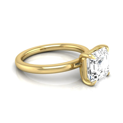 Asscher cut lab grown diamond solitaire engagement ring featuring a classic four-prong setting with a yellow gold tone band.