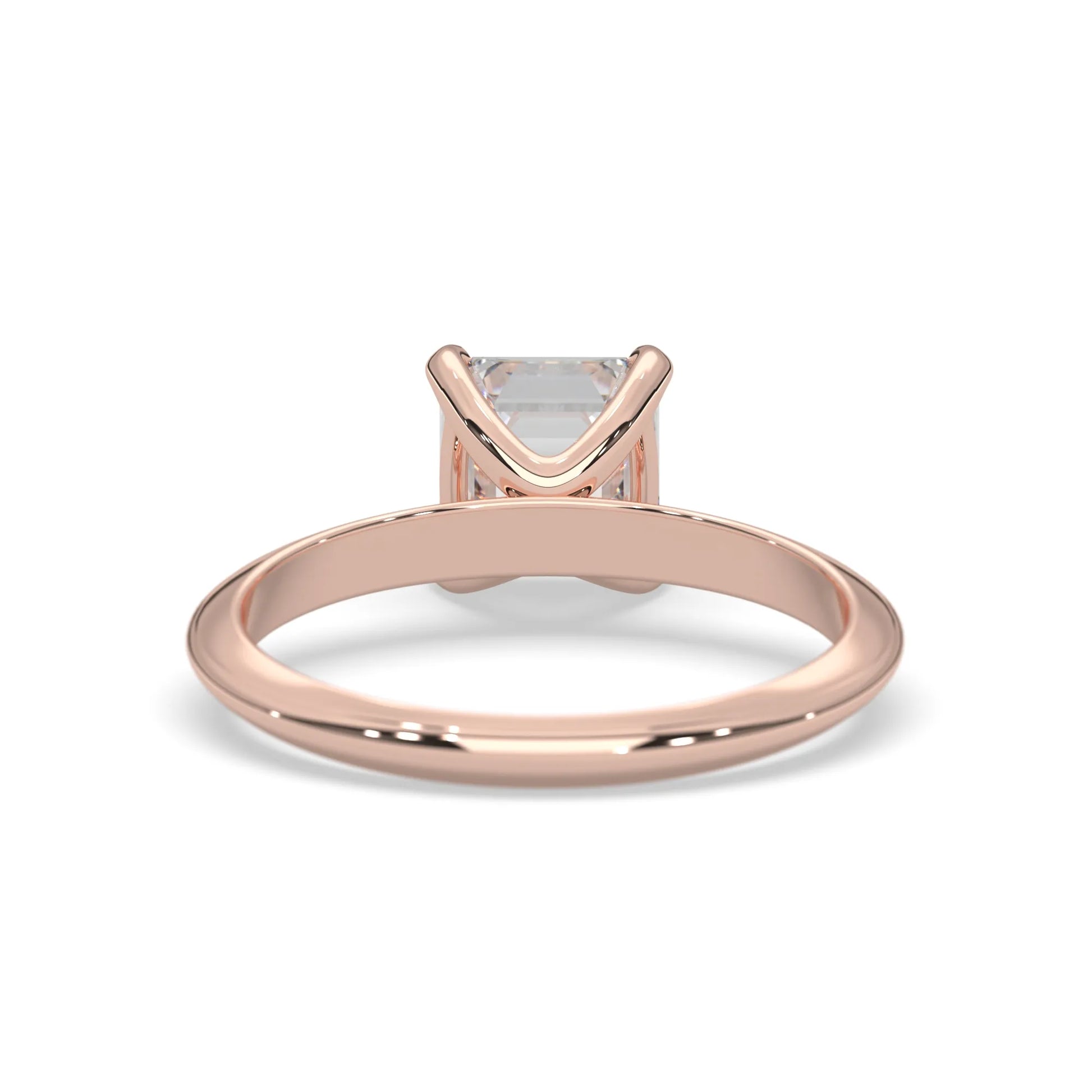 Rose-gold ring with a diamond on a white background