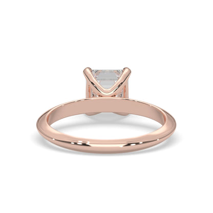 Rose-gold ring with a diamond on a white background