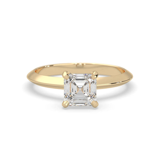 yello-Gold ring with a clear gemstone on a white background