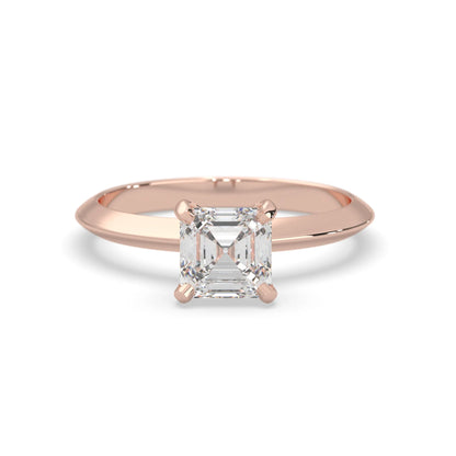 Rose-gold ring with a diamond on a white background