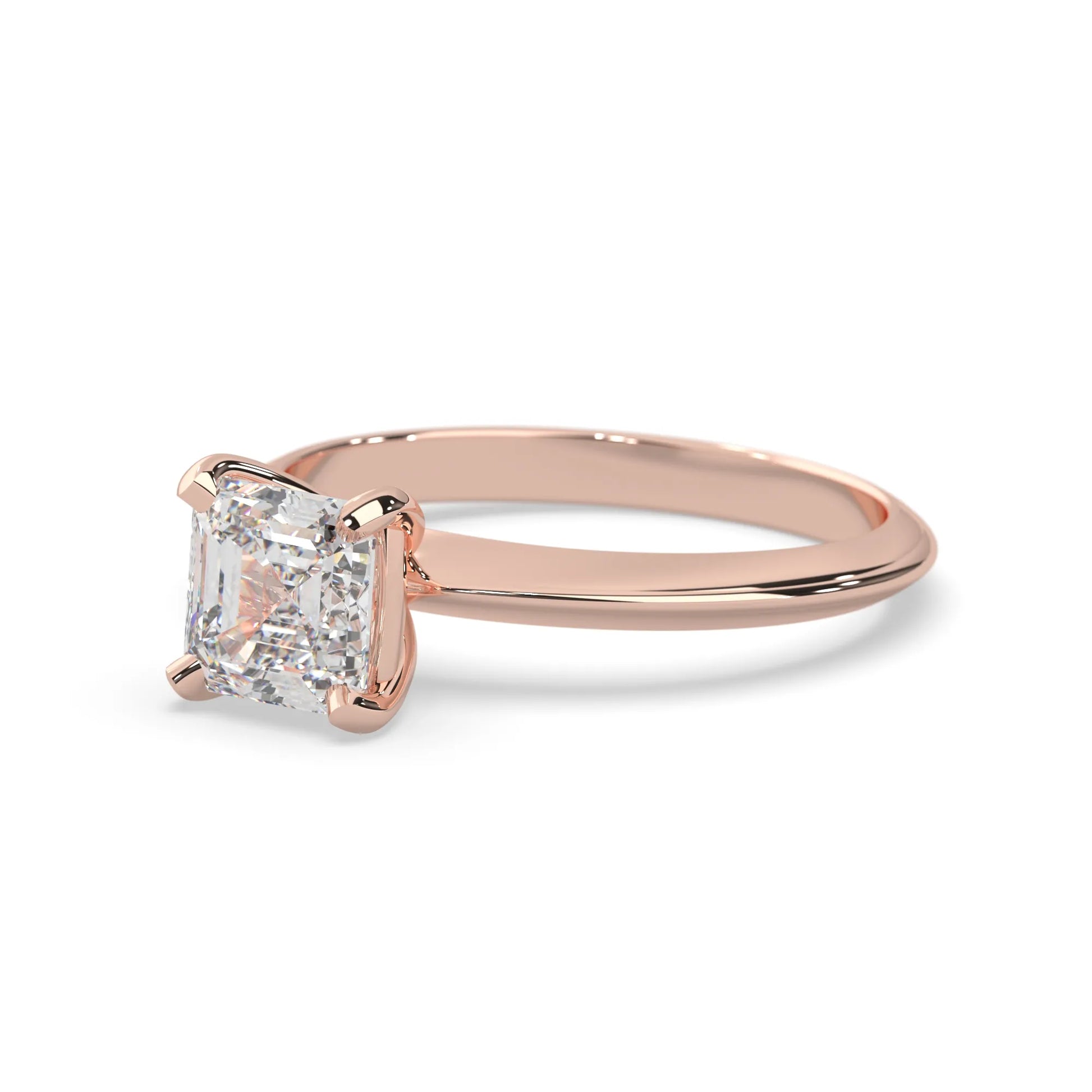 Rose-gold ring with a large diamond on a white background
