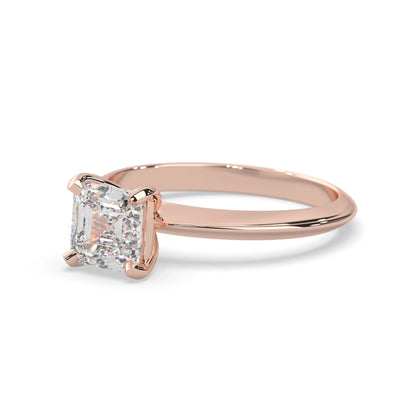 Rose-gold ring with a large diamond on a white background