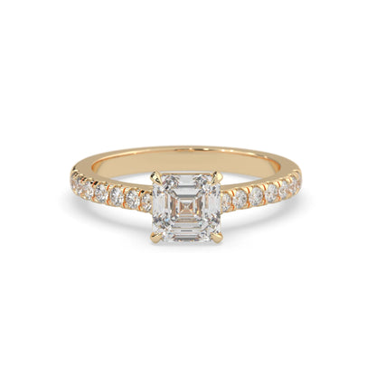 asscher cut lab grown diamond prong set engagement ring with pavé band and yellow gold  metal tone design