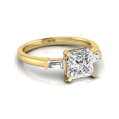 Asscher cut lab grown diamond three stone engagement ring featuring a 2.40 carat Asscher center diamond with baguette side diamonds in a classic prong setting in yellow gold
