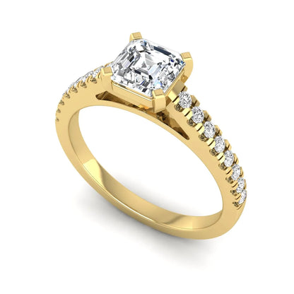 Asscher cut lab grown diamond solitaire engagement ring featuring a four-prong center diamond with a pavé-set round diamond band in a yellow gold finish.