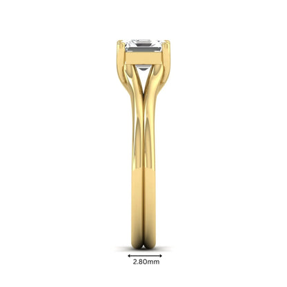 IGI Certified 1.25 carat Asscher cut lab grown diamond solitaire engagement ring with elegant split shank band in yellow gold.