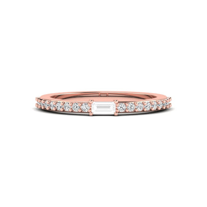 Baguette cut lab grown diamond band ring featuring a bar-prong set center diamond with round accent diamonds on a slim rose gold style band.