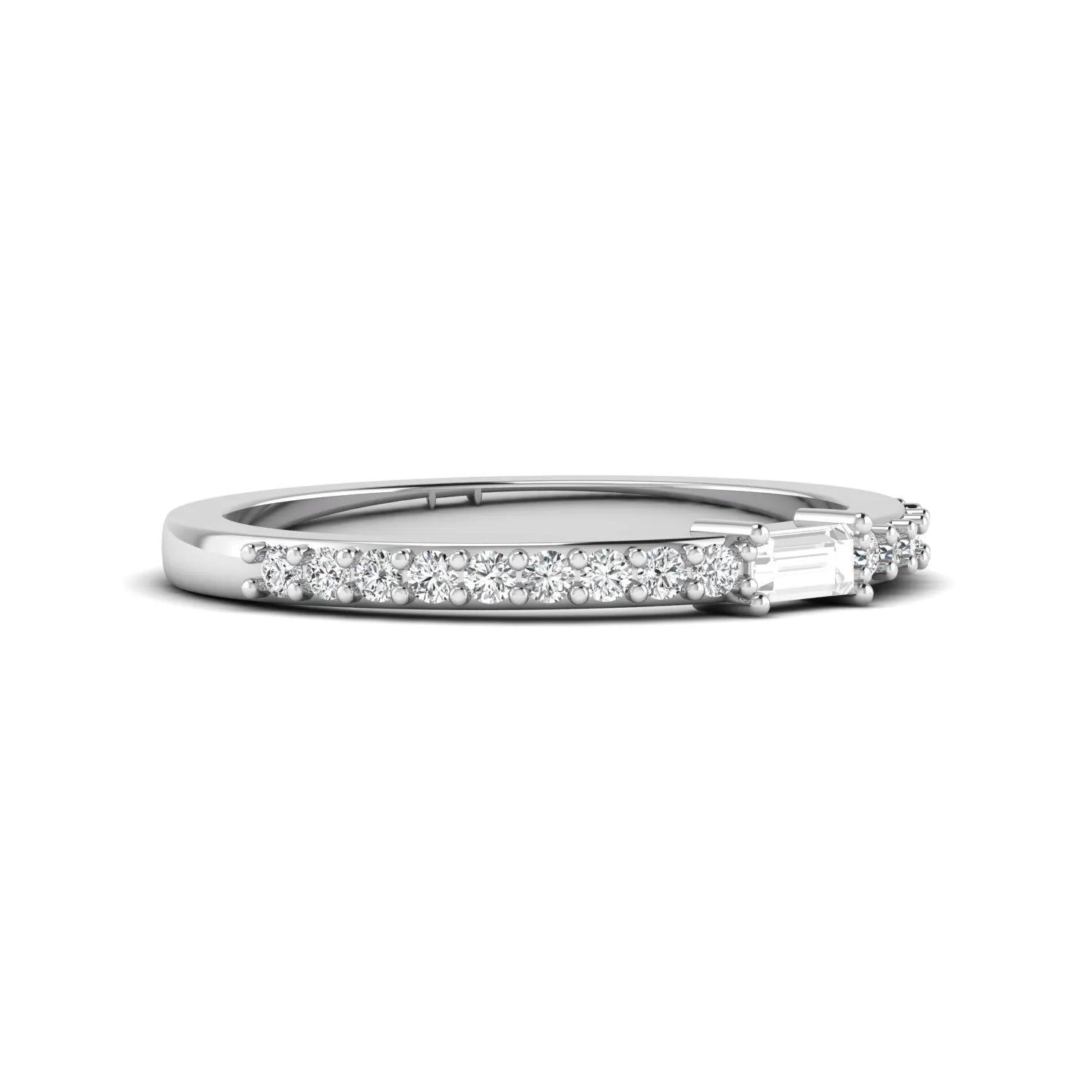 Baguette cut lab grown diamond band ring featuring a bar-prong set center diamond with round accent diamonds on a slim white gold style band.