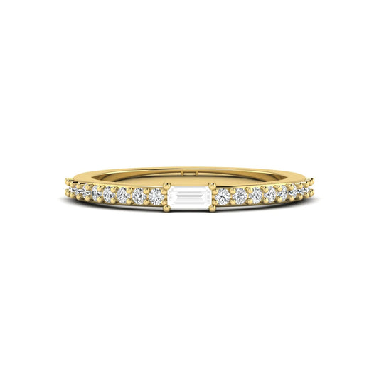 Baguette cut lab grown diamond band ring featuring a bar-prong set center diamond with round accent diamonds on a slim yellow gold style band.