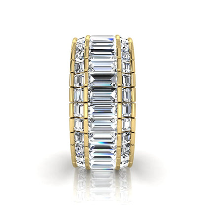 Full eternity band featuring baguette cut lab grown diamonds in a channel-style setting with a yellow gold tone finish.