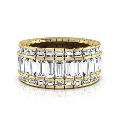 Full eternity band featuring baguette cut lab grown diamonds in a channel-style setting with a yellow gold tone finish.