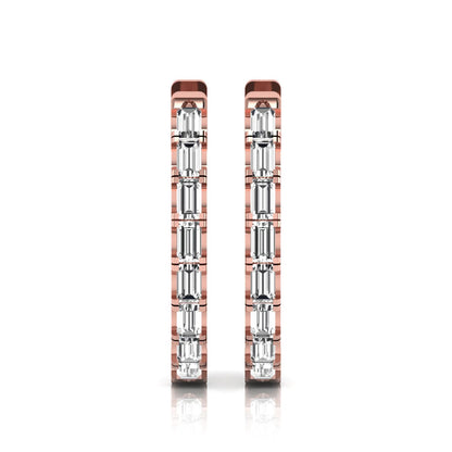 Lab grown diamond huggie hoop earrings featuring vertically arranged baguette cut diamonds in a sleek linear design on a rose gold hinged hoop.