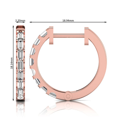 Lab grown diamond huggie hoop earrings featuring vertically arranged baguette cut diamonds in a sleek linear design on a rose gold hinged hoop.
