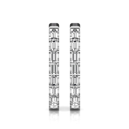 Lab grown diamond huggie hoop earrings featuring vertically arranged baguette cut diamonds in a sleek linear design on a white gold hinged hoop.