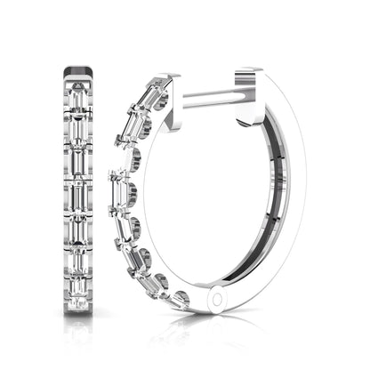 Lab grown diamond huggie hoop earrings featuring vertically arranged baguette cut diamonds in a sleek linear design on a white gold hinged hoop.