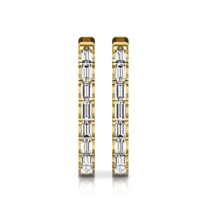 Lab grown diamond huggie hoop earrings featuring vertically arranged baguette cut diamonds in a sleek linear design on a yellow gold hinged hoop.