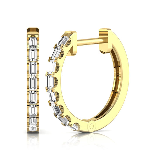 Lab grown diamond huggie hoop earrings featuring vertically arranged baguette cut diamonds in a sleek linear design on a yellow gold hinged hoop.