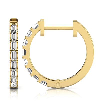 Lab grown diamond huggie hoop earrings featuring vertically arranged baguette cut diamonds in a sleek linear design on a yellow gold hinged hoop.