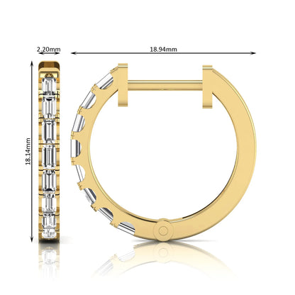 Lab grown diamond huggie hoop earrings featuring vertically arranged baguette cut diamonds in a sleek linear design on a yellow gold hinged hoop.