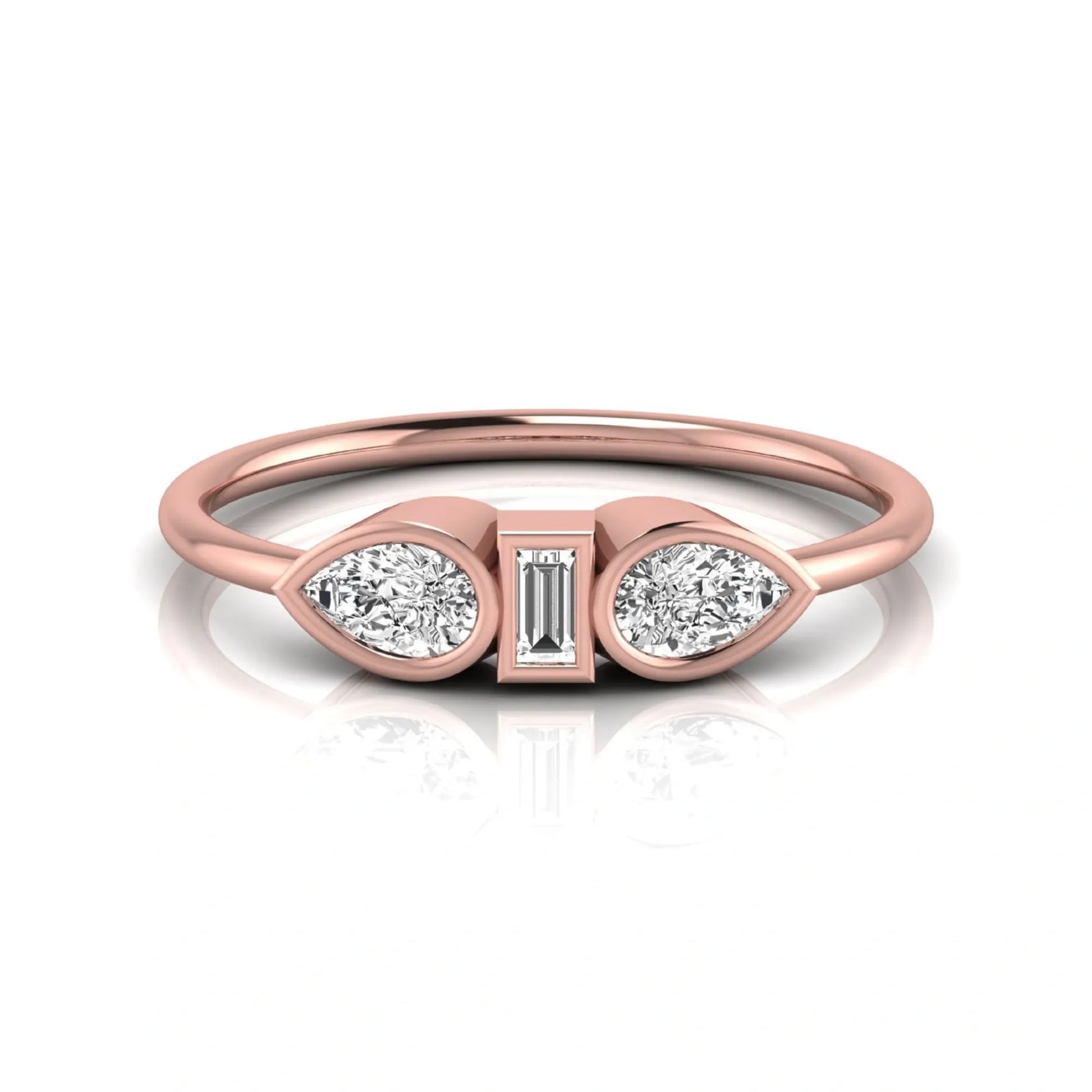 Rose-gold ring with three diamond settings on a white background