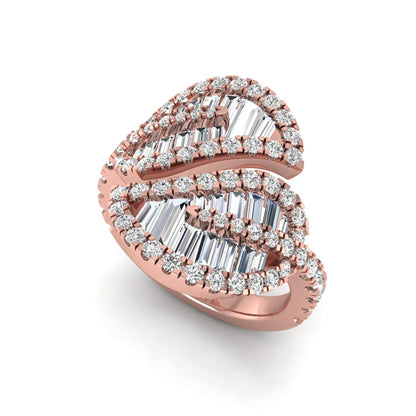 Baguette and round cut lab grown diamond bypass leaf ring with prong setting in rose gold tone.