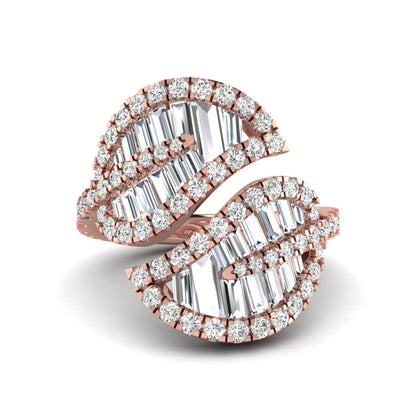 Baguette and round cut lab grown diamond bypass leaf ring with prong setting in rose gold tone.