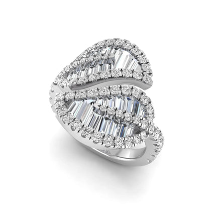 Baguette and round cut lab grown diamond bypass leaf ring with prong setting in white gold tone.