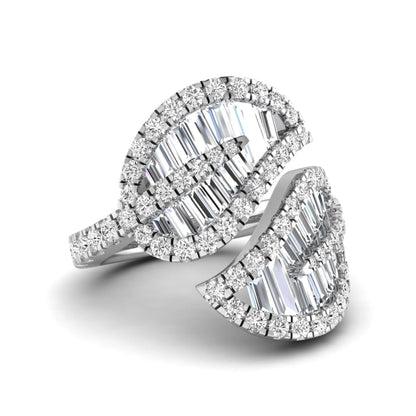 Baguette and round cut lab grown diamond bypass leaf ring with prong setting in white gold tone.