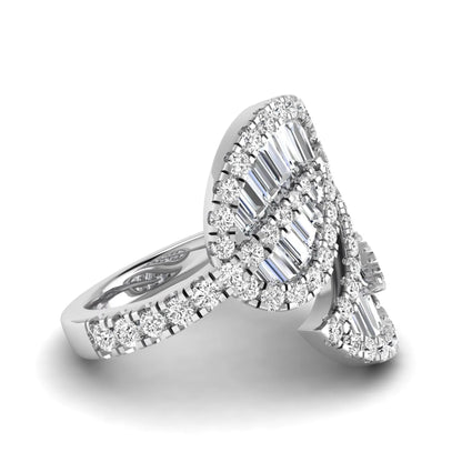 Baguette and round cut lab grown diamond bypass leaf ring with prong setting in white gold tone.