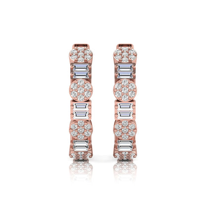 Lab grown diamond huggie hoop earrings featuring alternating baguette cut and round brilliant diamonds with pavé diamond detailing on a rose gold hinged hoop.