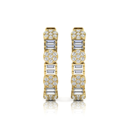 Lab grown diamond huggie hoop earrings featuring alternating baguette cut and round brilliant diamonds with pavé diamond detailing on a yellow gold hinged hoop.