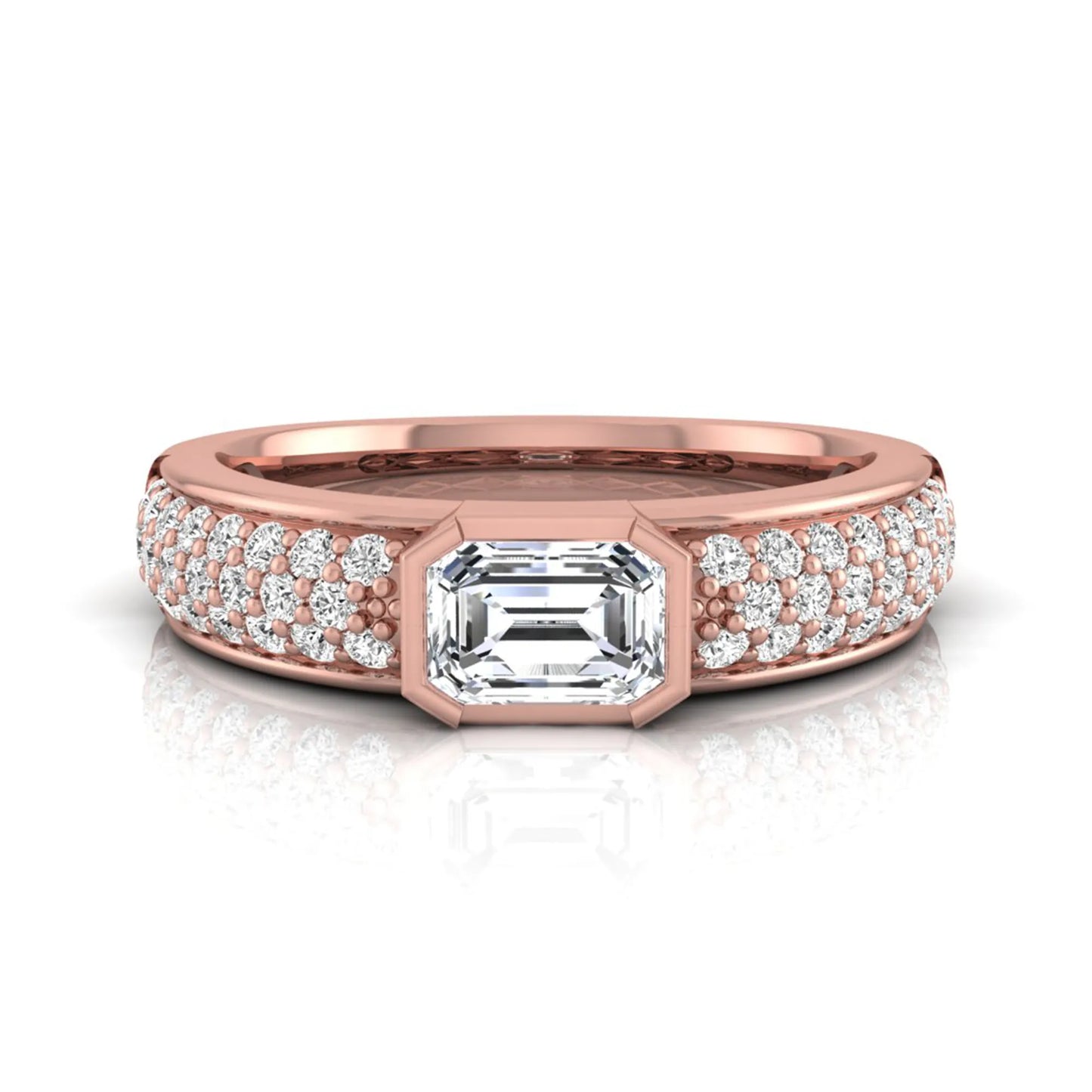 Bezel set emerald cut lab grown diamond engagement ring featuring a 0.52 carat emerald center diamond with pavé round diamond band in rose gold.