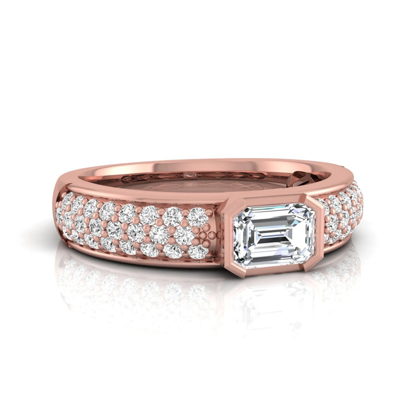 Bezel set emerald cut lab grown diamond engagement ring featuring a 0.52 carat emerald center diamond with pavé round diamond band in rose gold.