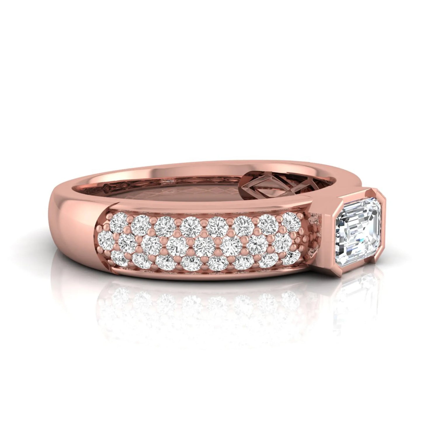 Bezel set emerald cut lab grown diamond engagement ring featuring a 0.52 carat emerald center diamond with pavé round diamond band in rose gold.